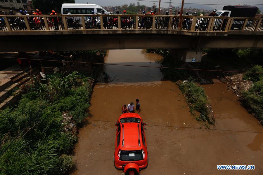 NEPAL-KATHMANDU-RAIN-STUCK CAR