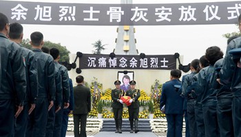 Ashes of fallen pilot placed in hometown cemetery